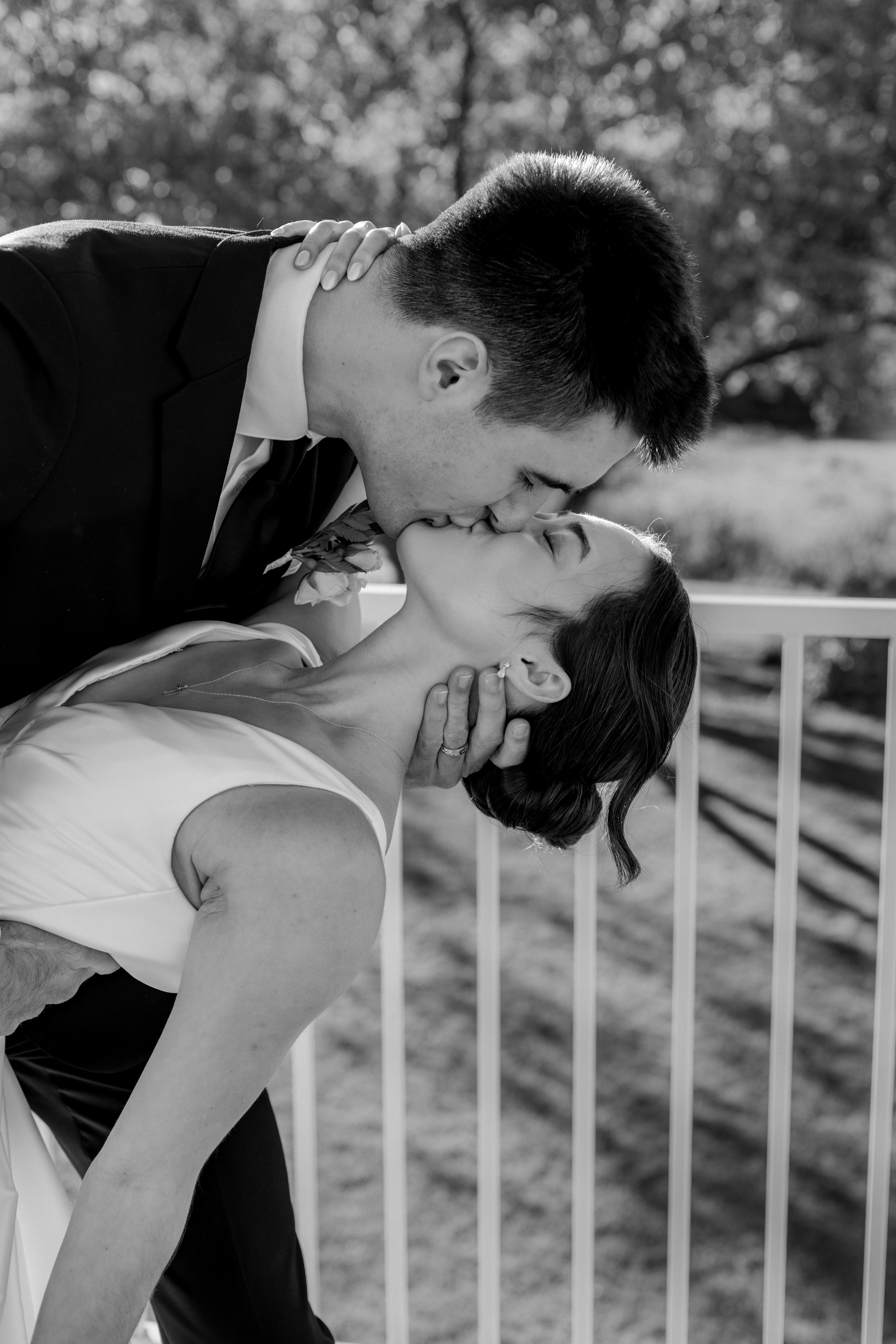 Bride and groom first kiss at Rustic Manor 1848