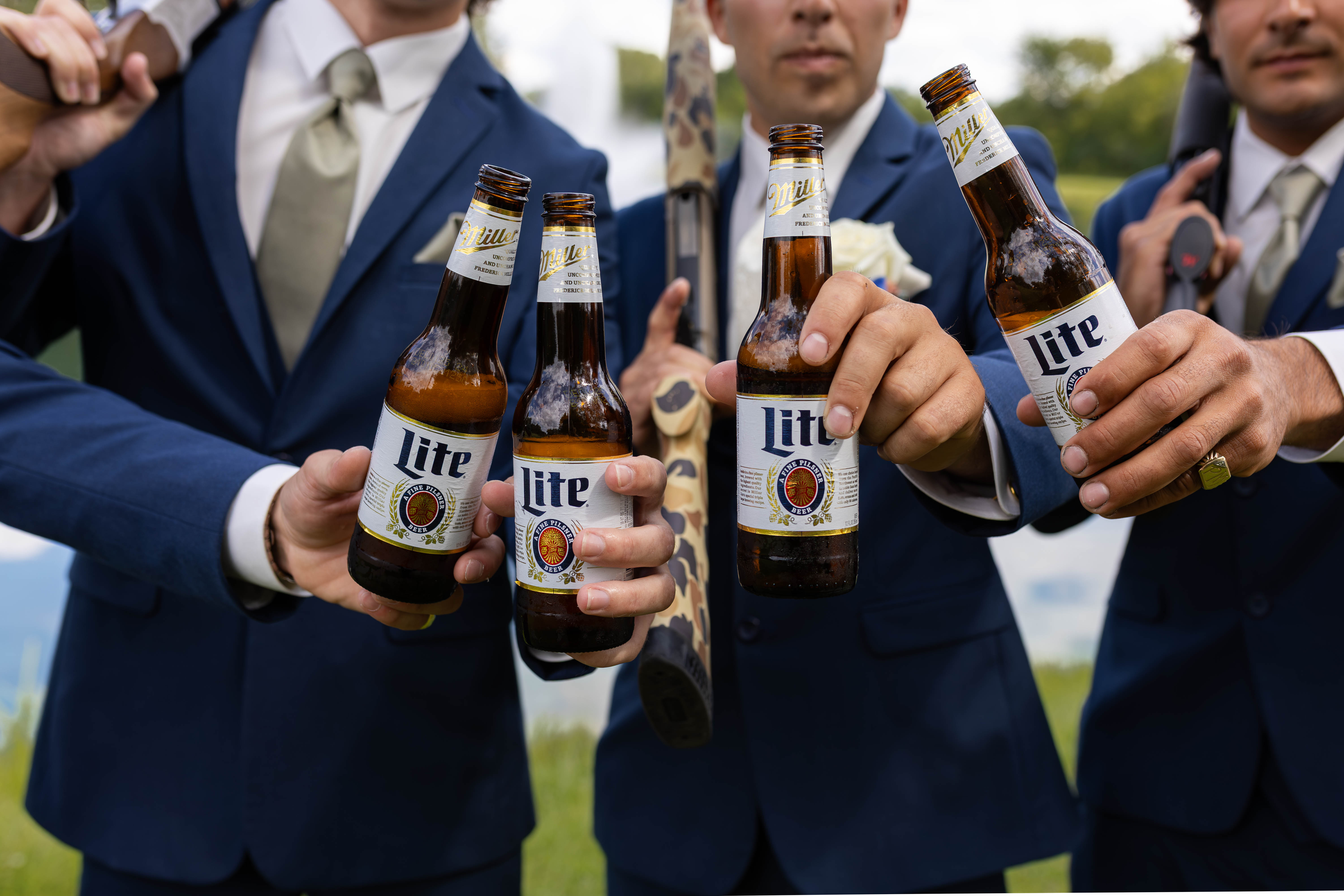 Groomsmen toasting with beer
